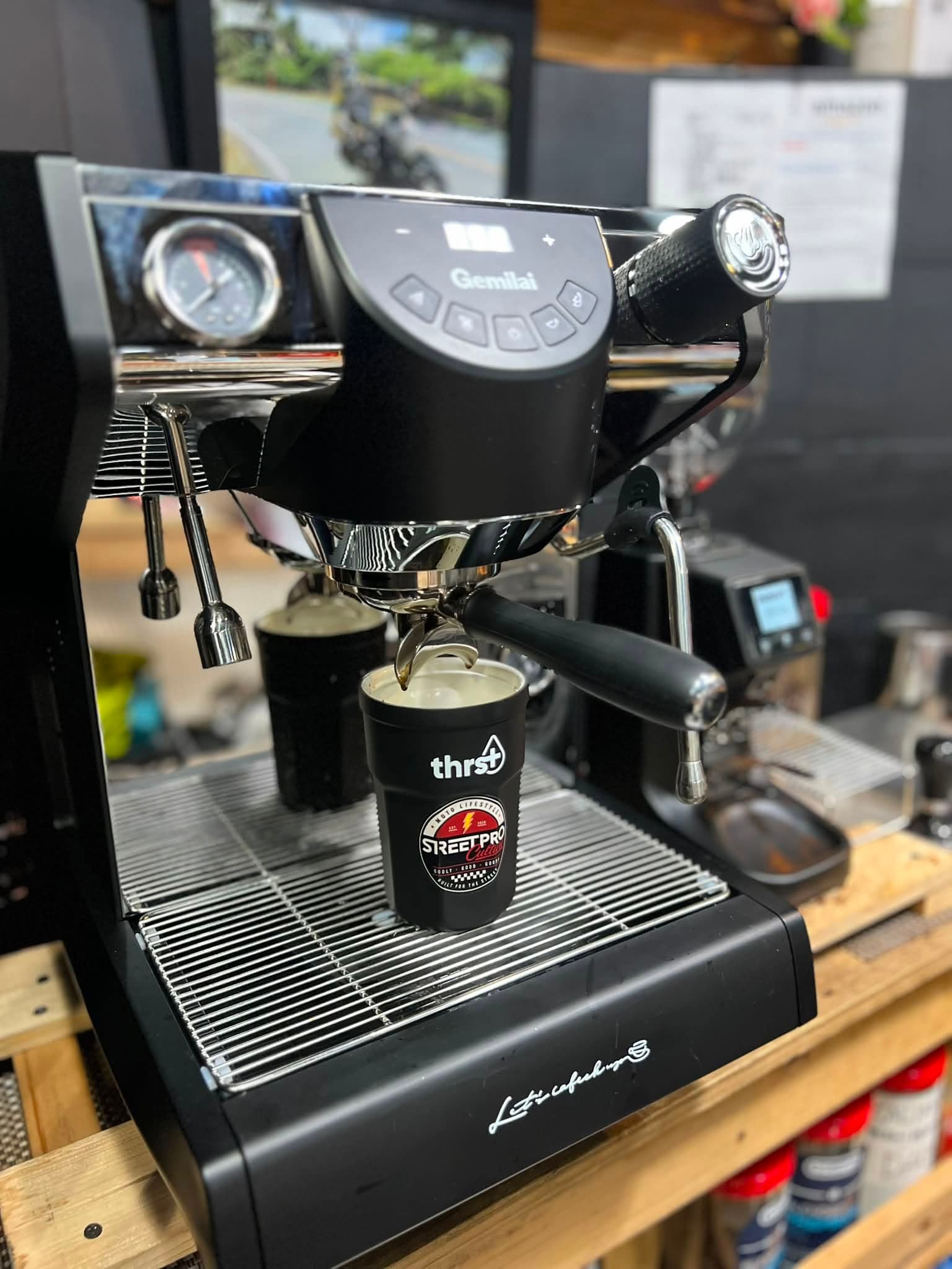 Espresso pulling into a Street Pro Culture cup at the KOPA+MLA counter